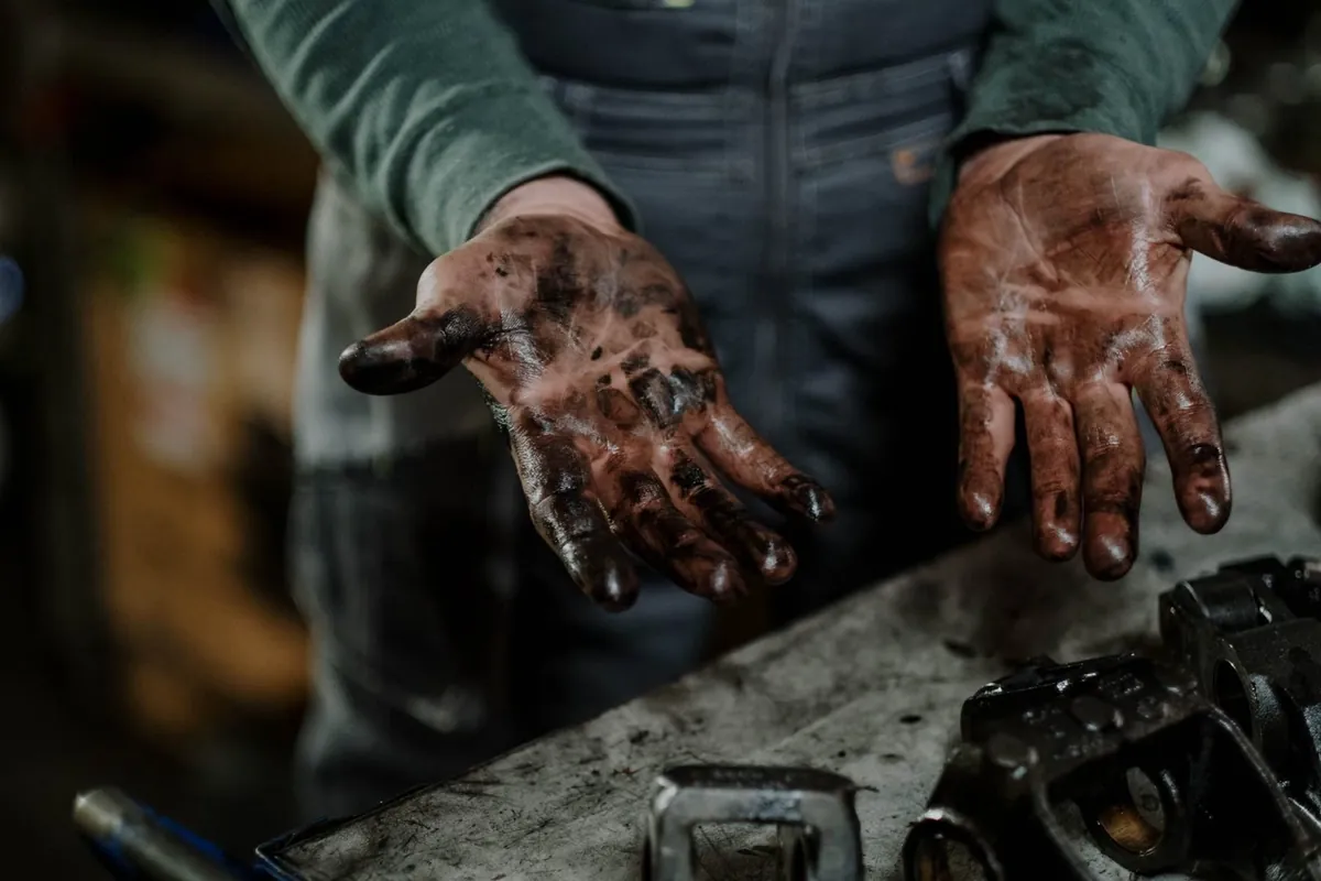 Grease-covered hands
